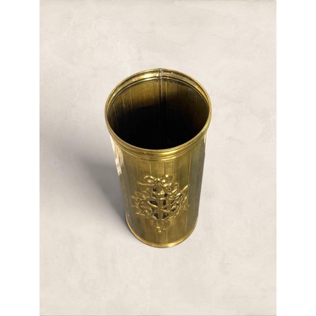 Vintage English Brass Embossed Umbrella Stand Wrapped in figural relief scenes, this brass umbrella stand has the kind of...
