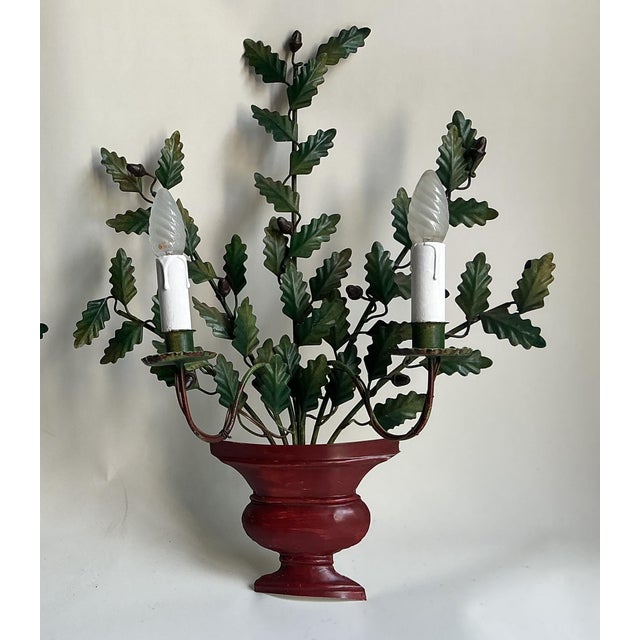 Highly detailed, lacquered metal oak leaves and small acorns, artistically arranged in reddish-brown urn bases. Classic...