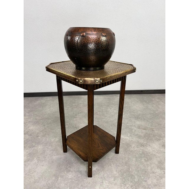 Jugendstil side table with hammered brass top. Professionally stained and repolished.