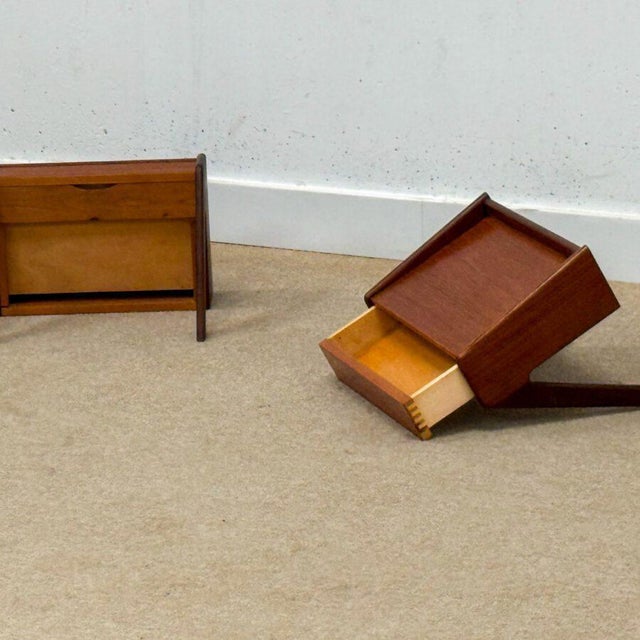 A beautifully sculptural pair of floating bedside tables designed by Omann Jun and handcrafted by Ølholm Møbelfabrik in...