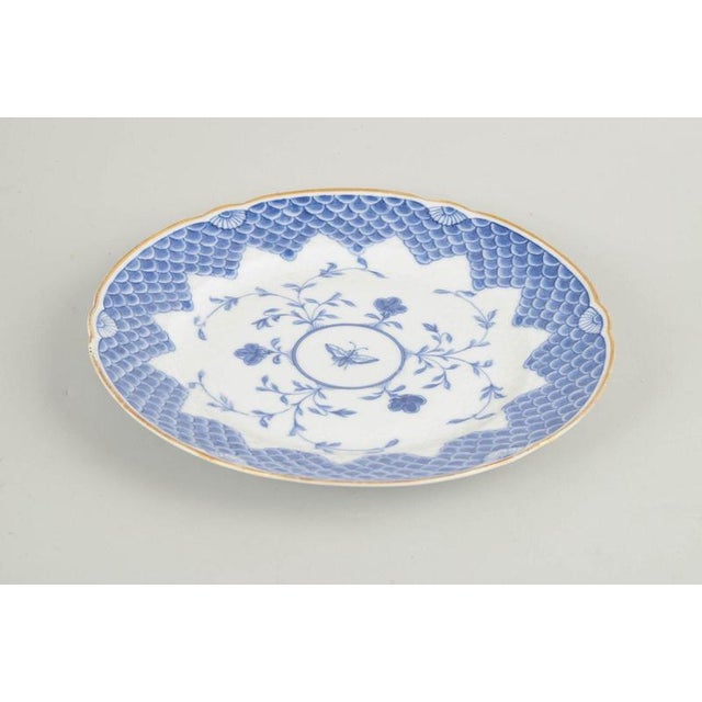 Bing & Grøndahl Butterfly dinner plate with gilt rim, 1880s. Antique round porcelain plate decorated in blue underglaze...