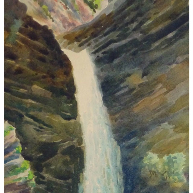 Magnificent French watercolor of a crystal blue waterfall spilling out from a rocky crevice by artist J. Aucante-Roy,...