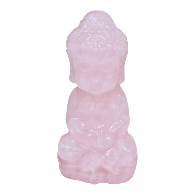 A luminous Baby Buddha sculpture, hand carved from solid, natural fine-grade rose quartz and polished to a silky smooth...