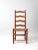 This is a vintage ladder back side chair with rush seat. Beautiful tone to the wood making it a lovely accent in the room.