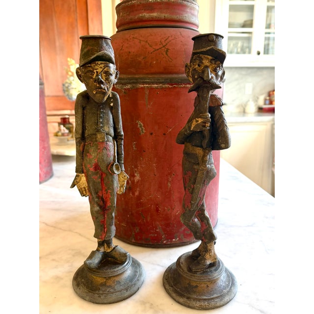 PAIR of 19th Century French Figural Candle Holders Patinated spelter metal figural candle holders in the form of humorous...