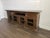 Freestanding 92" credenza with glass doors and 2 drawers; Glass panels can be changed to wood inserts.