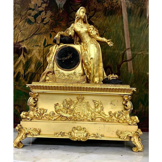 homage to Queen Victoria at her feet the attributes of the crown of England with the royal coat of arms of the lion and...