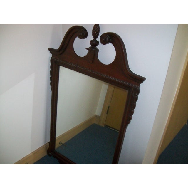 This vintage mirror is part of Columbia Myers 5 piece bedroom suite from the 1950s. It features a solid mahogany frame...