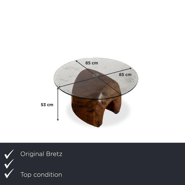A table by Bretz that's more sculpture than piece of furniture. The frame is a curved, organically shaped form that opens...