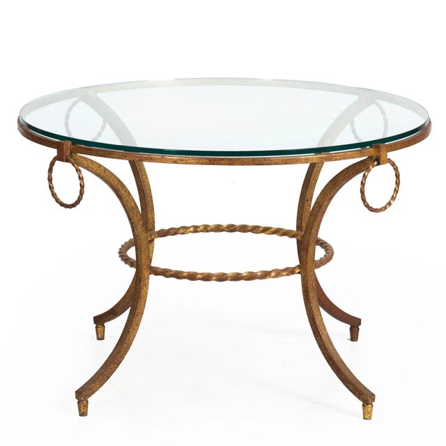 MODERNIST GILDED WROUGHT-IRON AND GLASS COFFEE TABLE French, circa 1950s | unmarked Item # 401RGG02P-1 An endlessly...