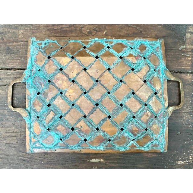 Meticulously crafted with a striking openwork lattice design, this vintage copper tray is a testament to enduring rustic...