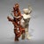 The artwork features a striking figure with multiple faces, intricately intertwined with an organic, sculptural element...