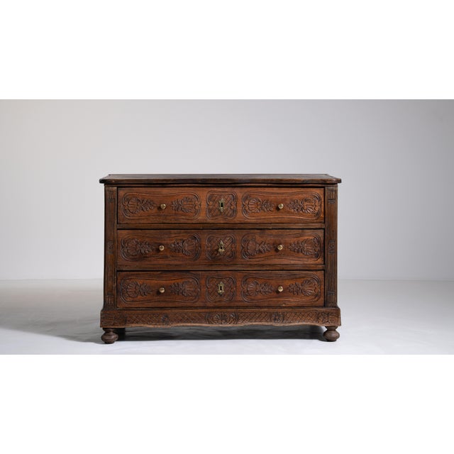 A masterwork of early 19th-century French craftsmanship, this chest of drawers bears the hallmarks of a period when...