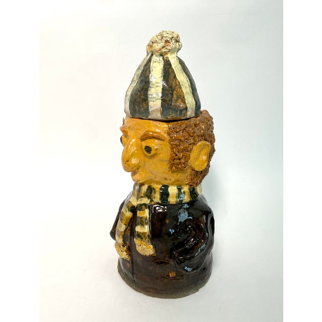 This charming character was handcrafted from clay and sourced in Prague. A two-piece vessel whose tasseled hat is the lid...