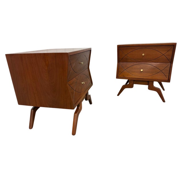 Elevate your bedroom with this stunning pair of vintage 1960s Mid-Century Modern walnut nightstands, beautifully...