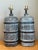 Distinguished by bold tactile texturing and rich brutalist earth tones, this pair of mid-century modern ceramic table...