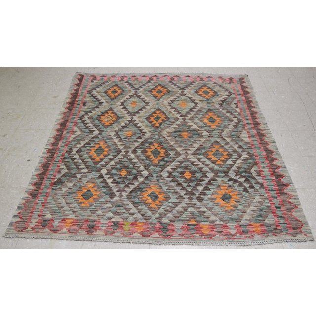 Vintage Afghan Maimana hand woven kilim with natural colors,organic wool and geometric pattern.