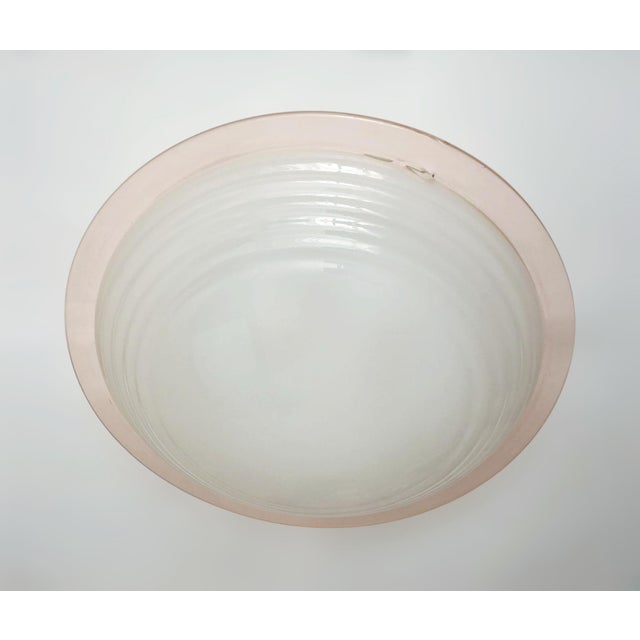 Vintage Italian flush mount or wall light with a frosted textured Murano glass shade enclosed in elegant salmon color...