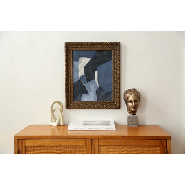 Original abstract painting in a marvelous antique golden-bronze frame. This organic piece has a palette of deep blues and...