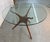 A striking blend of organic form and modern craftsmanship, this sculpted walnut dining table draws inspiration from the...