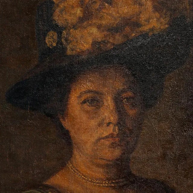 This original oil on canvas portrait of a standing woman in evening wear is signed and dated in the lower left Vige 1909...