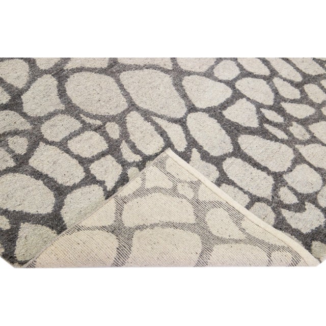 Beautiful Contemporary Thom Filicia Home Collection Rugs. This Indian hand-knotted rug is made of wool & viscose and has a...