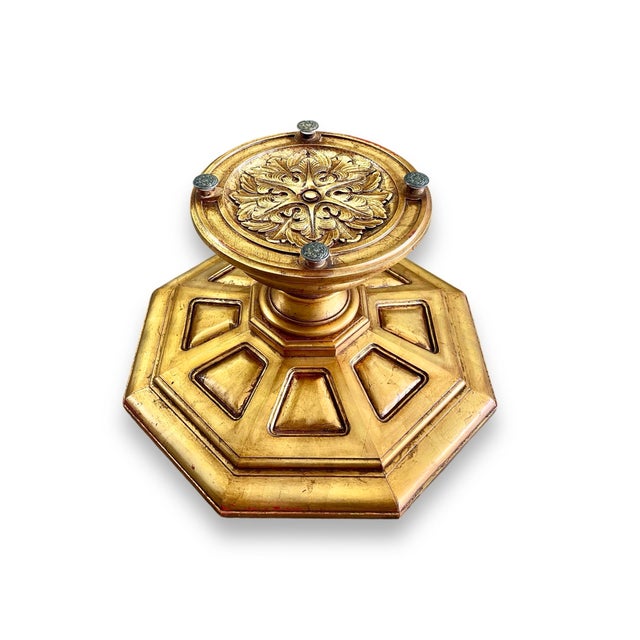 A 1960s Hollywood Regency coffee table epitomizing the glamorous side of mid-century style. The octagonal giltwood base...