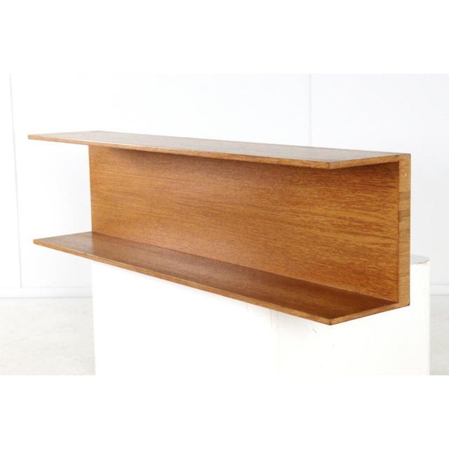 This stylish wooden wall shelf is designed in the Danish Design style. The warm wood and clean lines perfectly complement...