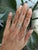 A finely crafted semi-mount ring in solid 14K white gold, set with twelve lab grown diamond accents and ready for a centre...