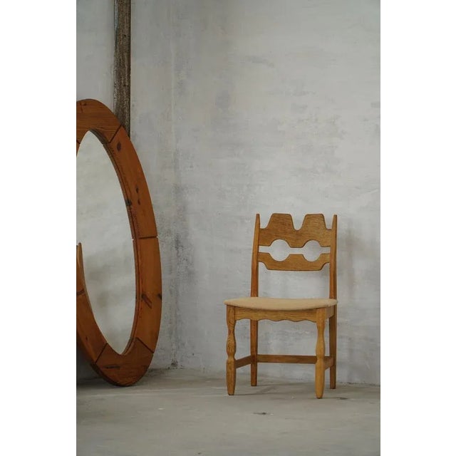 A striking set of six dining chairs designed by henning kjærnulf for e.g. Møbler, denmark, circa 1960s. Crafted in solid...