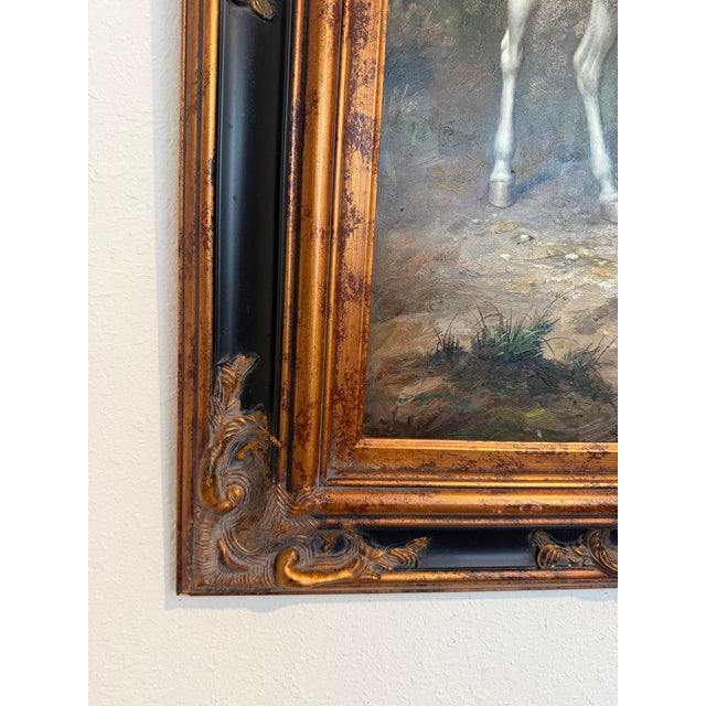 This finely executed oil on canvas depicts a classic English fox hunting scene, featuring a distinguished rider dressed in...