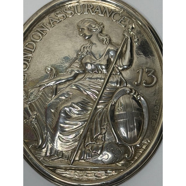 George III London Assurance Britannia Plaque – Hallmarked Sterling Silver, Hennell Family, London, Circa 1801 A rare and...