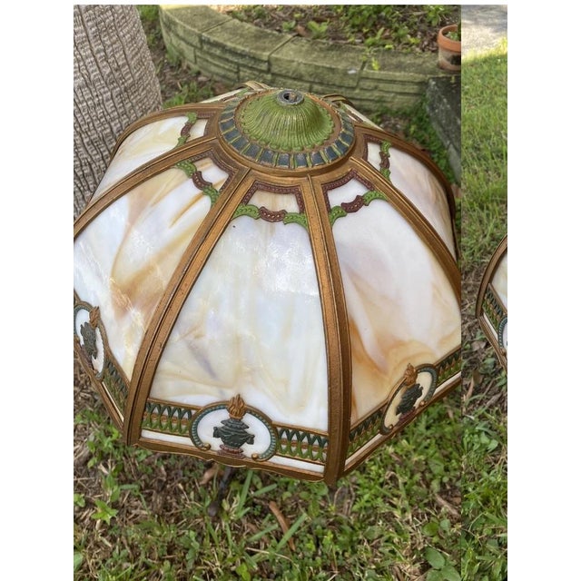 Slag glass lamps, particularly those from the late 19th and early 20th centuries, are a significant part of decorative...