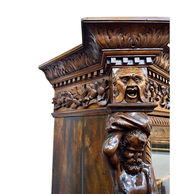 This exuberantly carved display case is a magnificent example of a 19th-century French or Italian Renaissance Revival...