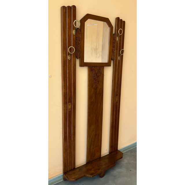 Art Decò Coat rack floor stand with four round bronze hangers. Details Dimensions Height: 72.05 in. (183 cm) Width: 32.29...