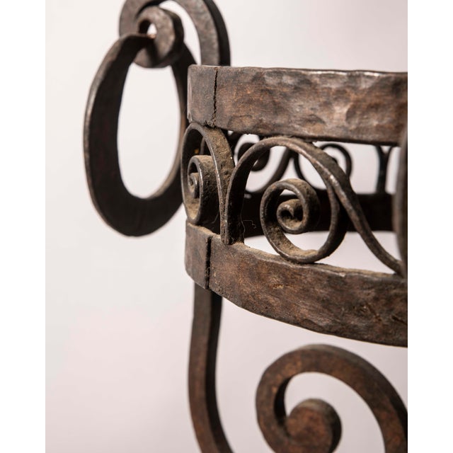 Decorative European-style standing planter, handcrafted in wrought iron during the first half of the 20th century. The...