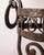 Decorative European-style standing planter, handcrafted in wrought iron during the first half of the 20th century. The...