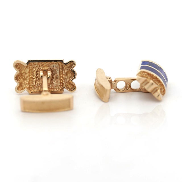 Vintage cufflinks featuring lapis lazuli inlay in 14K yellow gold with nugget textured sides. Rectangular lapis panels...