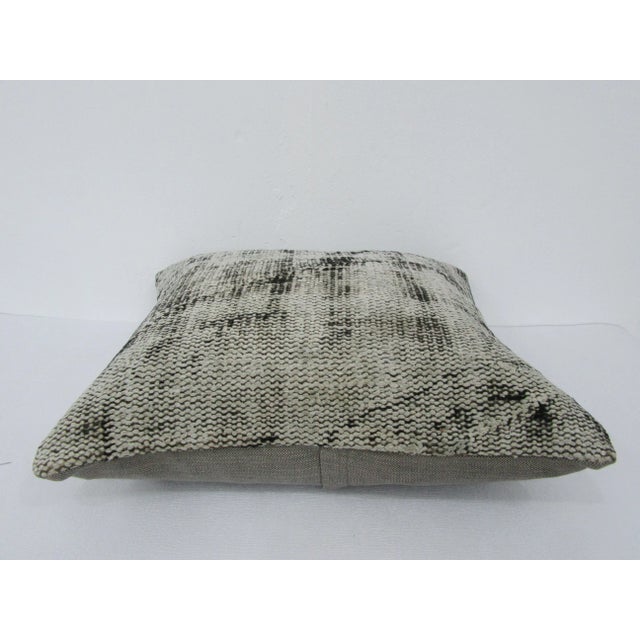 This is a pillow cover made from a vintage kilim rug. The piece was properly washed and ready to use. Pillow inserts not...