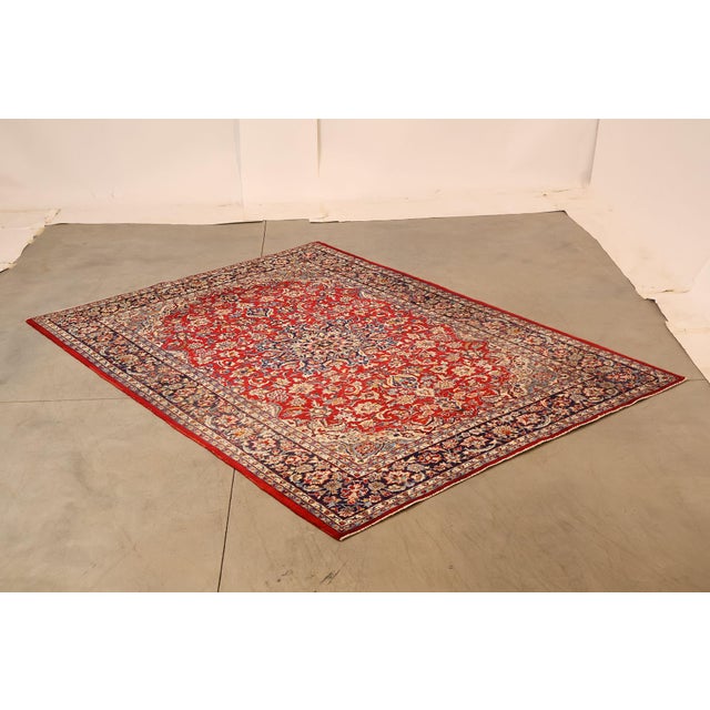 High Quality Hand Knotted Persian Style Wool Area Rug. Features A Red Field With Central Floral Medallion And Multi Border...
