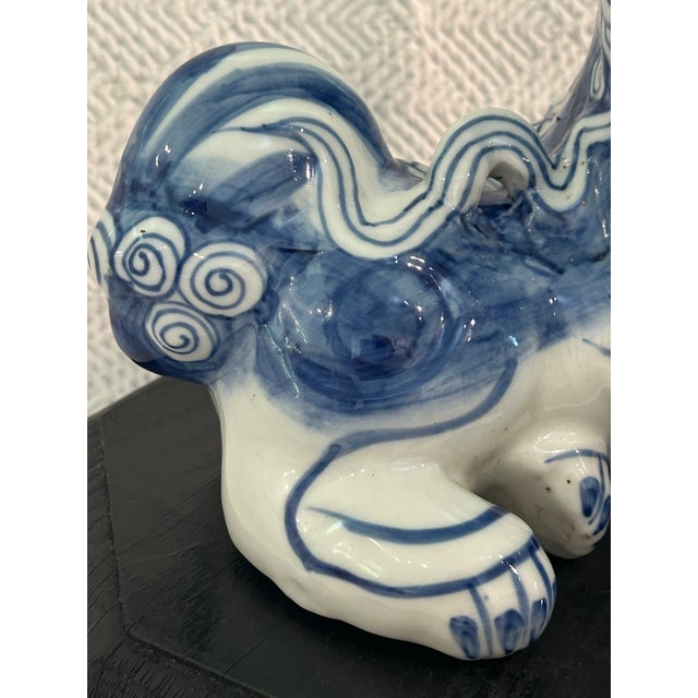 Wood Vintage Chinese Chinoiserie Blue & White Porcelain Foo Dog Guardian Lion on Wood Stand For Sale - Image 7 of 12