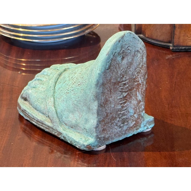 This is a decorative item . Place in a bookcase , hold your books up.