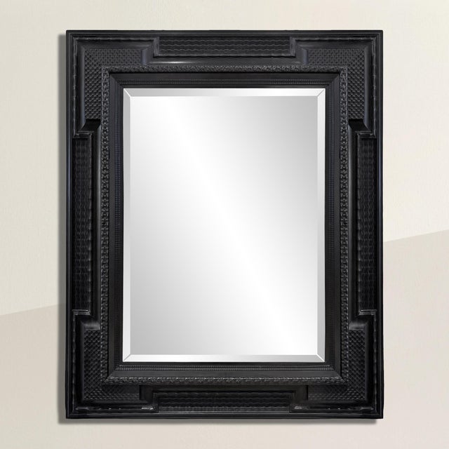 This massive 19th-century Dutch carved wood and ebonized frame is a true statement piece, showcasing an extraordinary...
