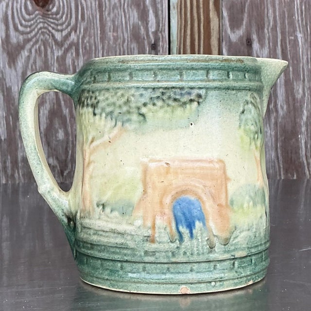 Embrace rustic elegance with this vintage Boho Roseville ceramic milk pitcher. A perfect blend of function and collectible...