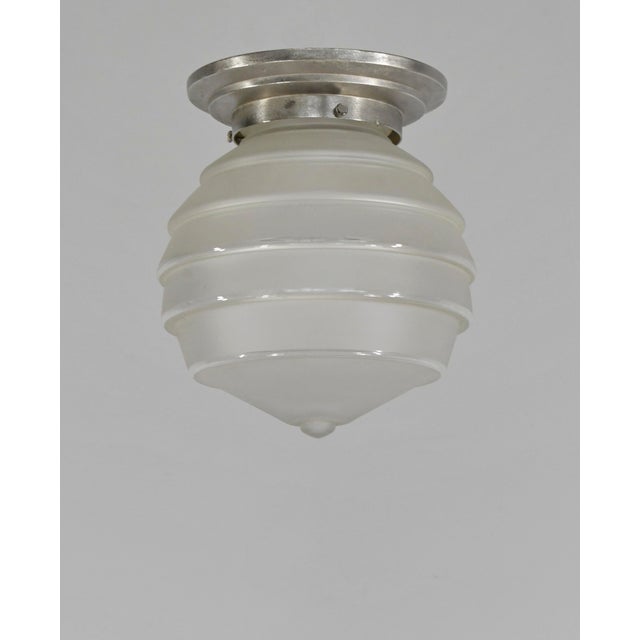 Flush mount A modernist French art deco ceiling light fixture made circa 1930-1940. The base in nickel plated solid brass...