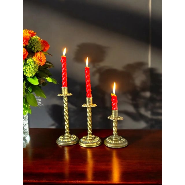 Beautiful antique brass candle holder set. These stunning candle holders are made of brass and have a very nice raised...