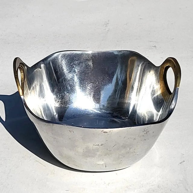 Offered is an aluminum and brass brutalist style bowl, attributed to Scottish designer David Marshall and made for The...