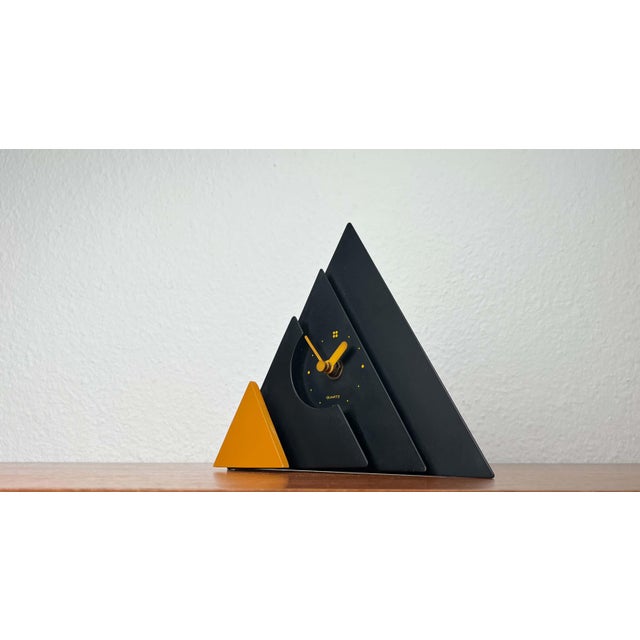 Vintage Japanese Black and Yellow Pyramide Table Clock from Makiko Taniguchi, 1980s, in Very Good conditions. Designed...