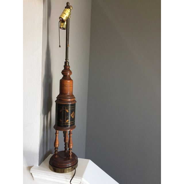 Center section of this Vintage, 1950s lamp has black leather and gold leaf stencil dual bulb table lamp. brass finial...
