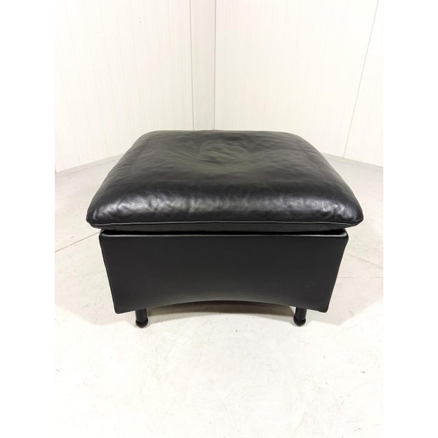 Black leather square hocker / footstool by Franz-Josef Schulte for de Sede, Switzerland (marked). This older edition still...
